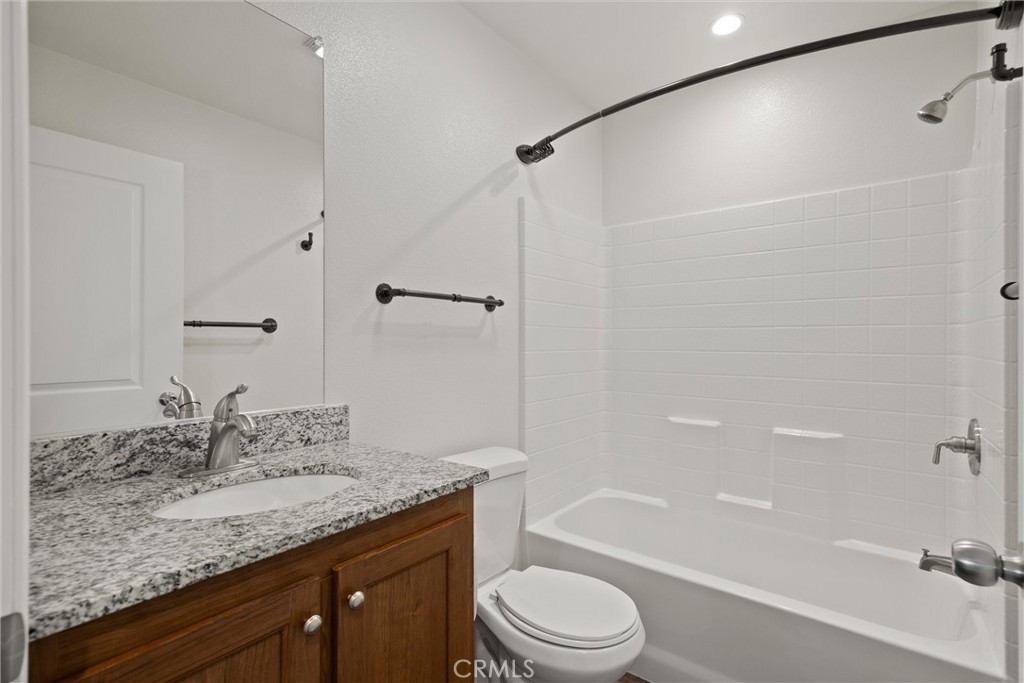 1575 La Grand View Road Paradise, CA 95969 - Photo 24 of 38 a bathroom with a granite countertop sink toilet and shower