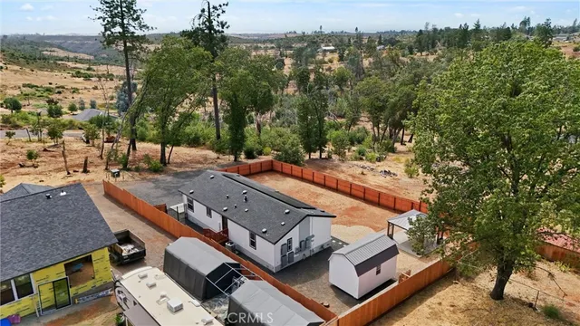 an aerial view of residential house with outdoor space