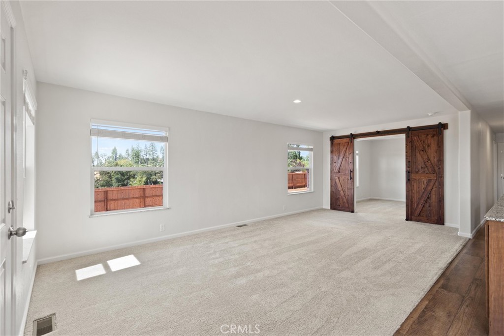 1575 La Grand View Road Paradise, CA 95969 - Photo 6 of 38 an empty room with a window and a ceiling fan