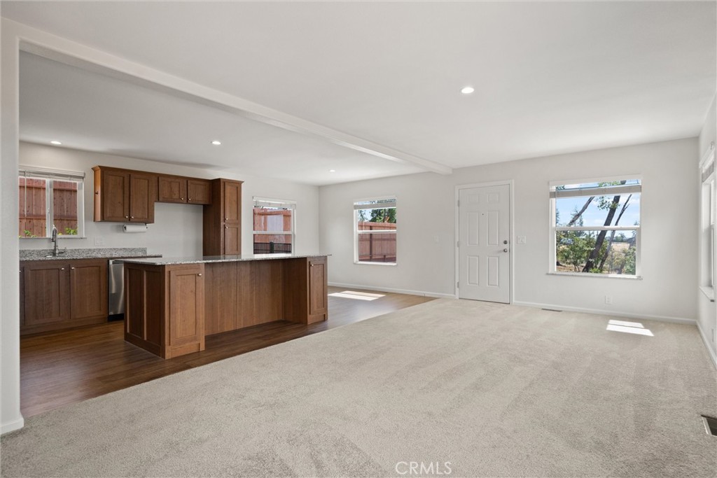 1575 La Grand View Road Paradise, CA 95969 - Photo 10 of 38 a view of kitchen with stainless steel appliances granite countertop a stove top oven a sink dishwasher and a refrigerator with wooden floor