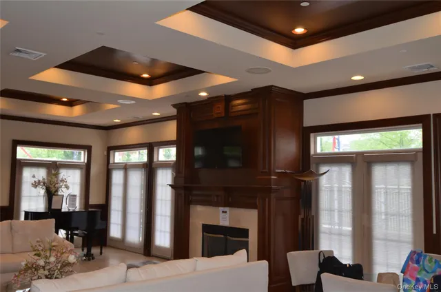 a lobby with furniture and a fireplace