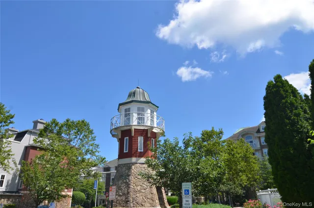 a view of a houses with a flower garden