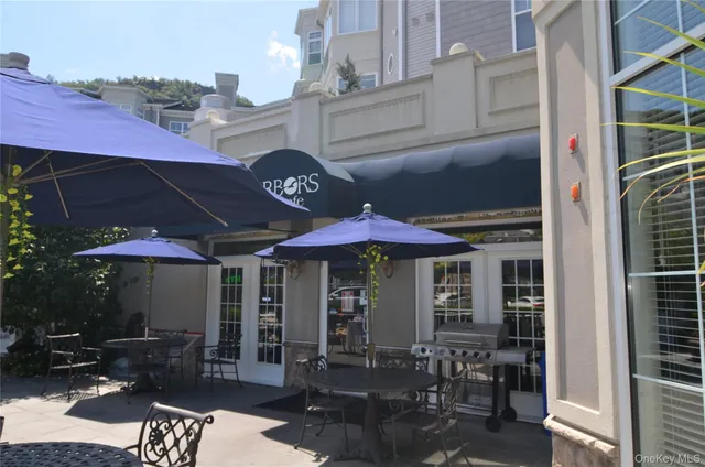 a view of a cafe with sitting area