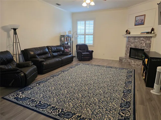 a living room with furniture and a fireplace