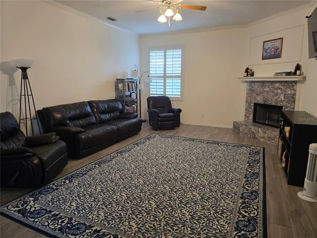 a living room with furniture and a fireplace