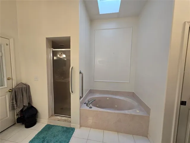 a bathroom with a tub and a sink