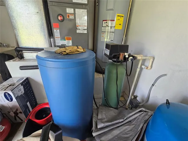 a living room with furniture and a mirror