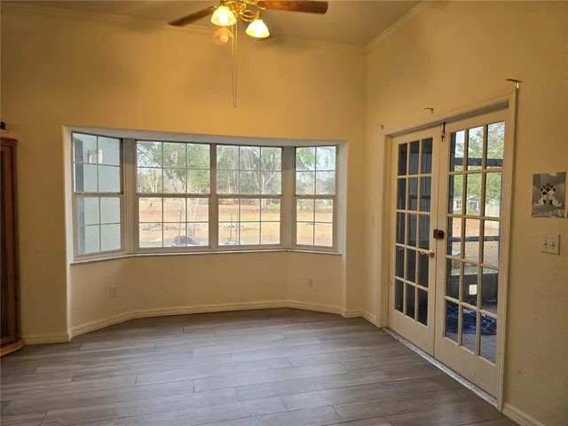 a kitchen with stainless steel appliances granite countertop a refrigerator and a stove