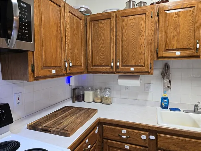 a bathroom with a sink a mirror and a shower curtain