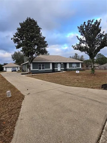 a view of house with outdoor space