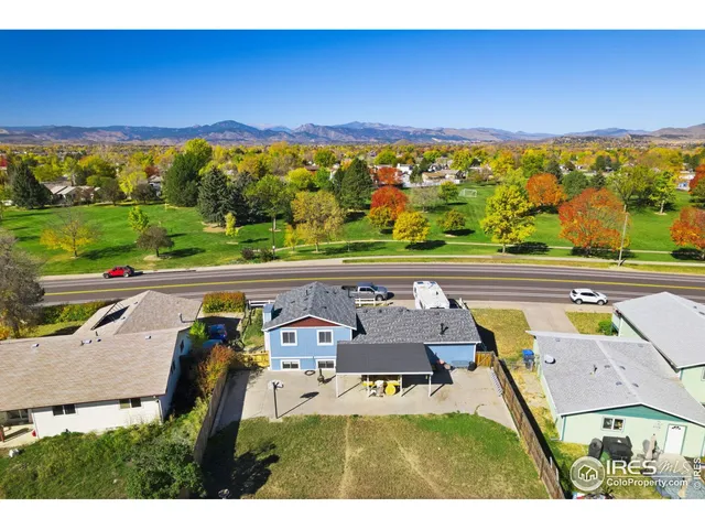 an aerial view of residential house with outdoor space and swimming pool