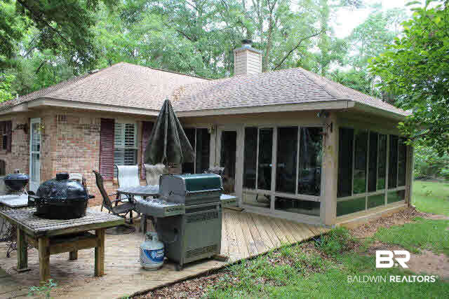 10375 Russ Road Daphne, AL 36526 - Photo 2 of 25 Large Florida room (heated and cooled) with windows on 3 sides with protectant seal, tile flooring. Wooden Deck for cook outs