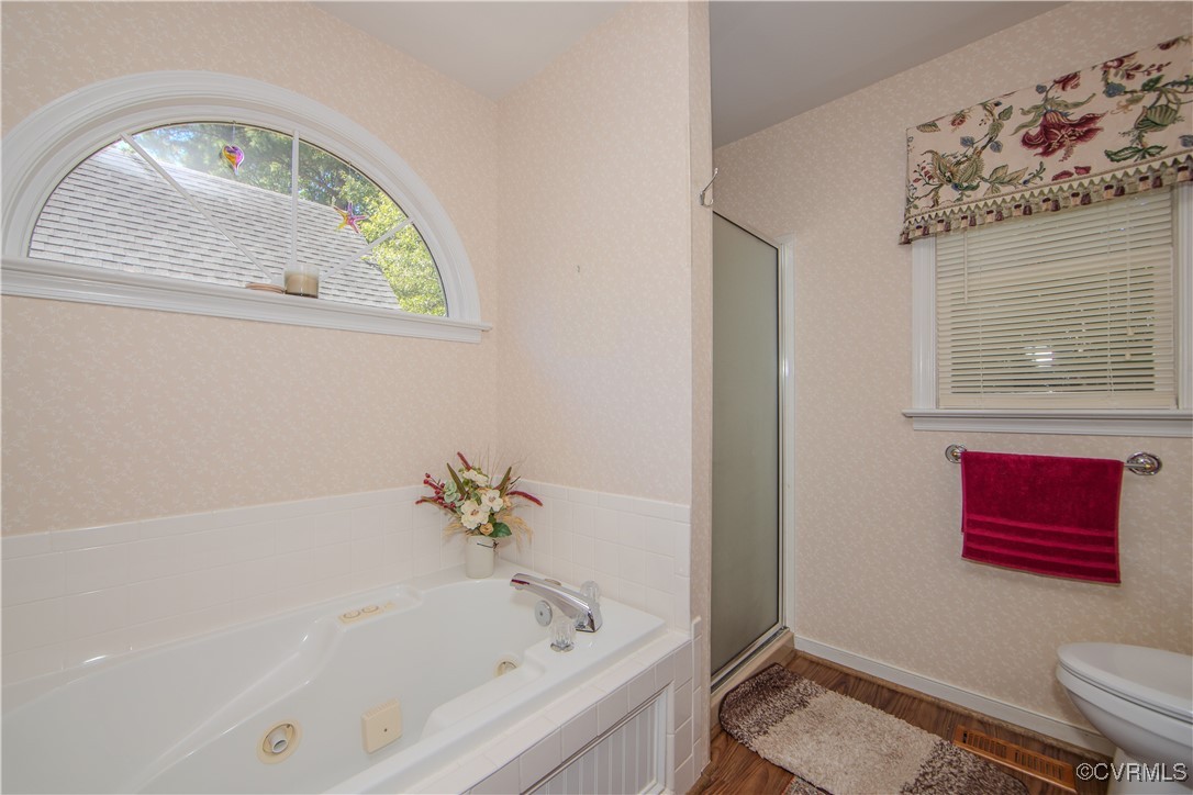 5720 Long Cove Road Midlothian, VA 23112 - Photo 18 of 31 a bathroom with a bathtub and a shower