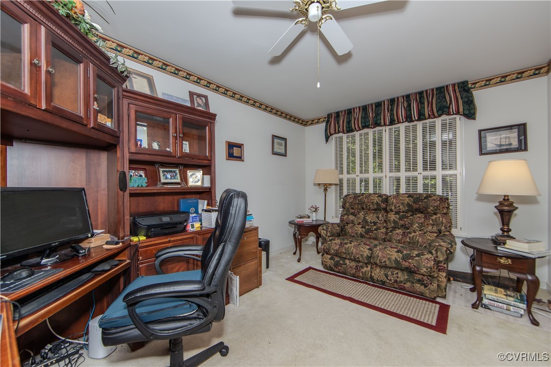 5720 Long Cove Road Midlothian, VA 23112 - Photo 20 of 31 a living room with furniture and a flat screen tv