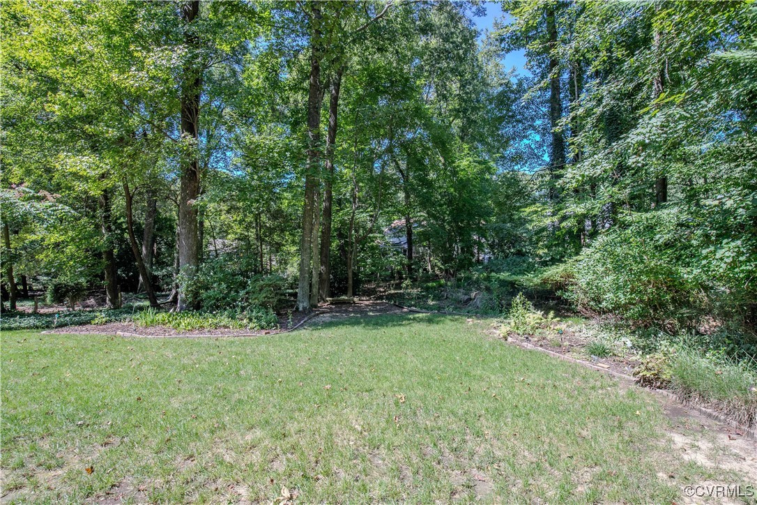5720 Long Cove Road Midlothian, VA 23112 - Photo 5 of 31 a view of outdoor space with a garden and trees