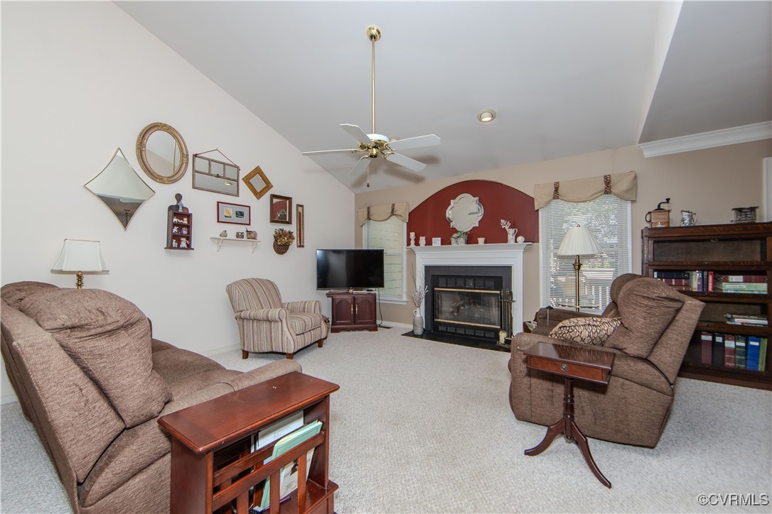 5720 Long Cove Road Midlothian, VA 23112 - Photo 31 of 31 a living room with furniture a fireplace and a chandelier