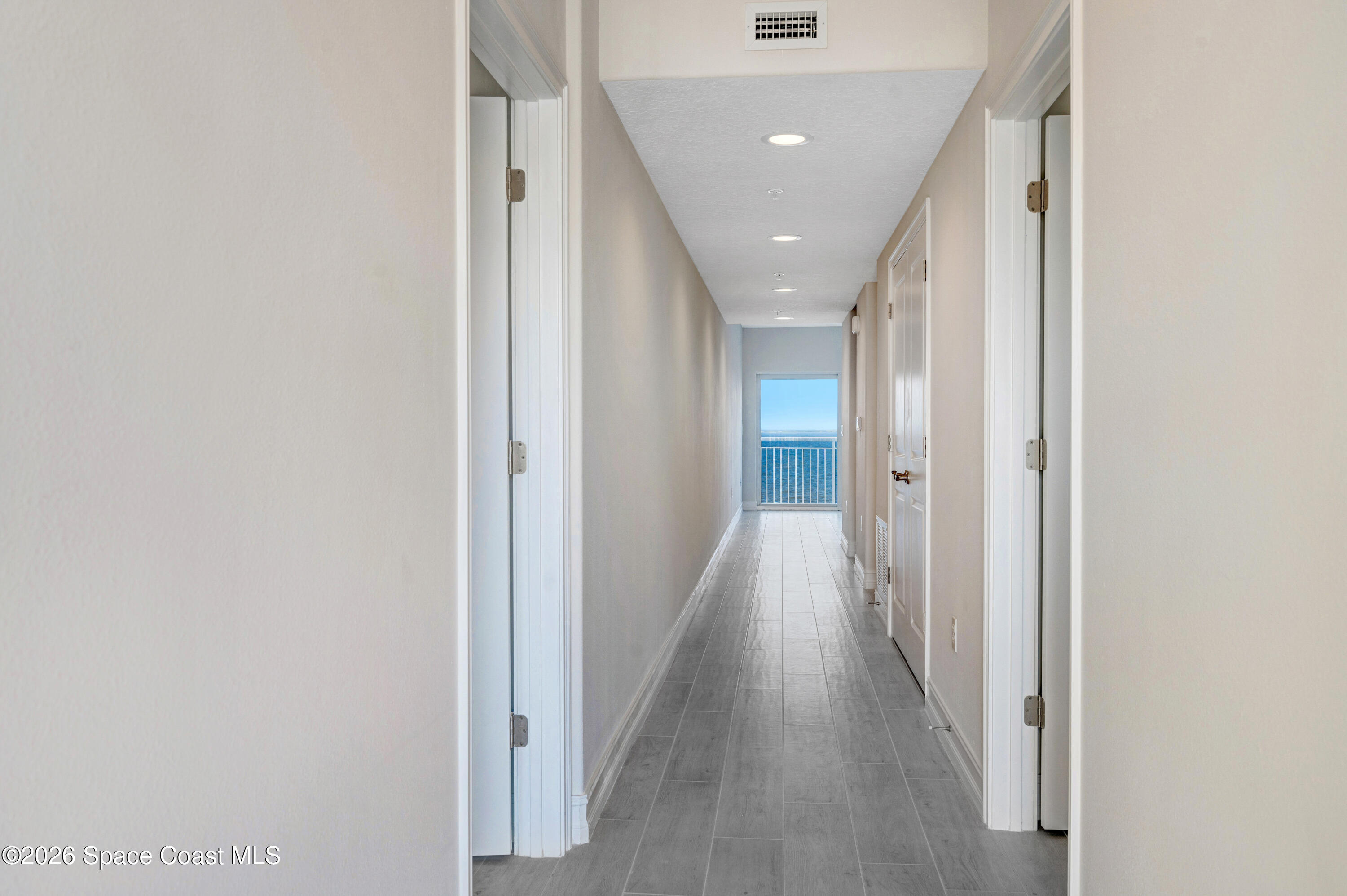1805 Riverside Drive, Unit 304 Titusville, FL 32780 - Photo 15 of 46 a view of a hallway with wooden floor