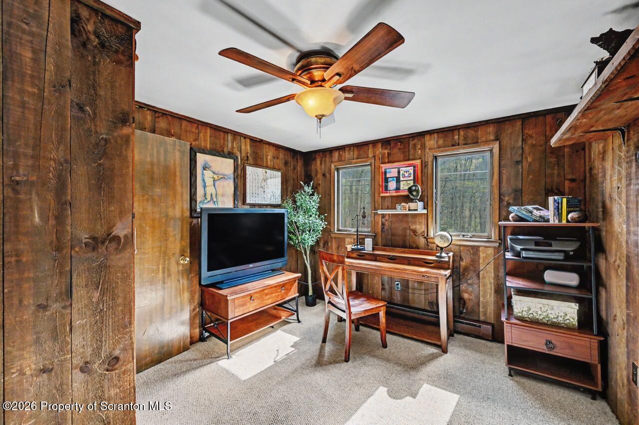 719 Scott Road Clarks Summit, PA 18411 - Photo 20 of 51 a living room with furniture a flat screen tv and a window