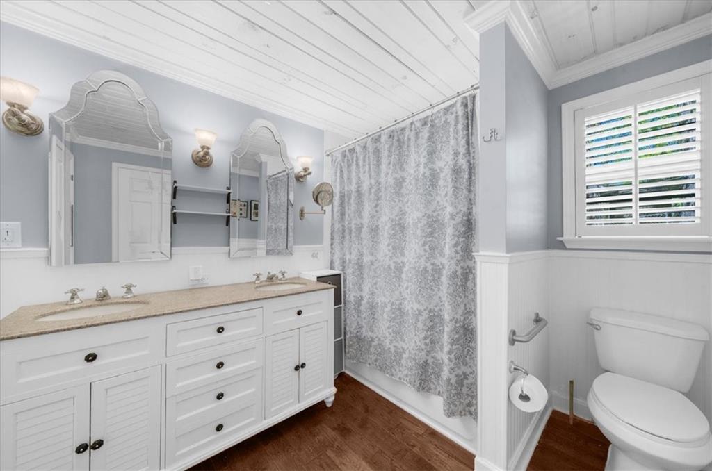 6551 Bermuda Lane Flowery Branch, GA 30542 - Photo 18 of 43 a bathroom with a double vanity sink toilet and shower