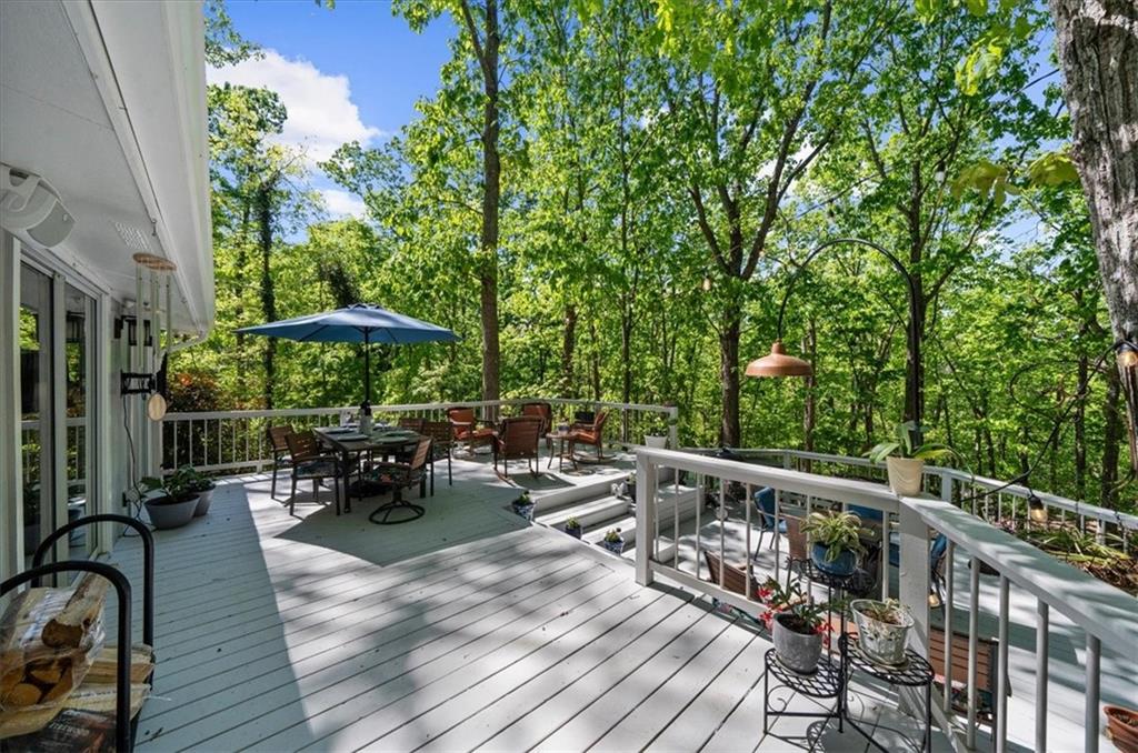 6551 Bermuda Lane Flowery Branch, GA 30542 - Photo 23 of 43 a view of chairs and tables in the balcony