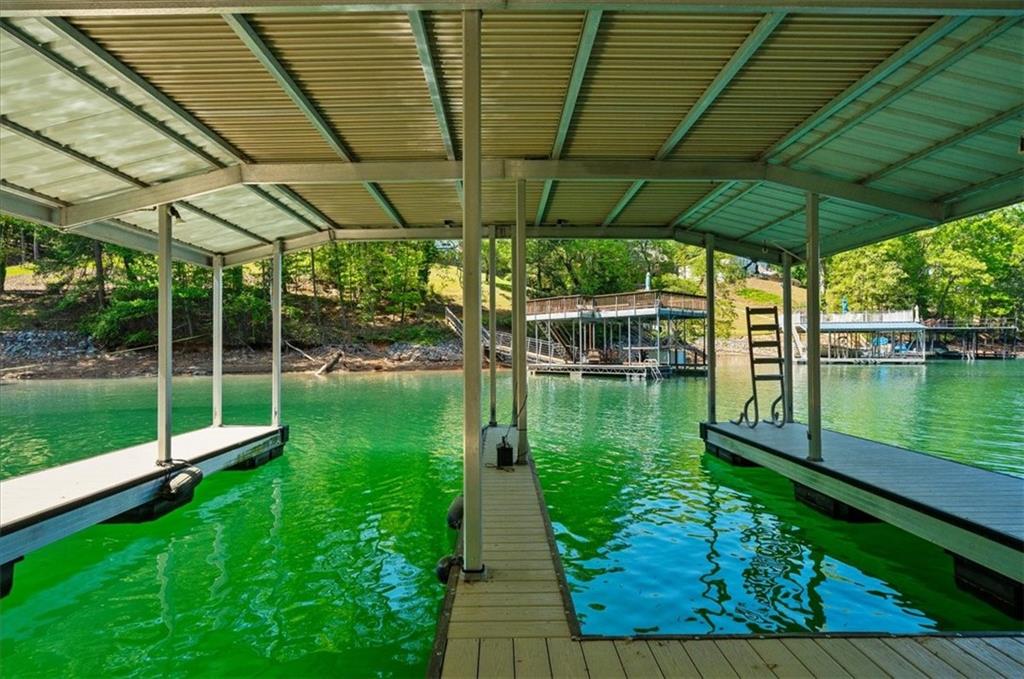6551 Bermuda Lane Flowery Branch, GA 30542 - Photo 33 of 43 a view of a swimming pool with a patio