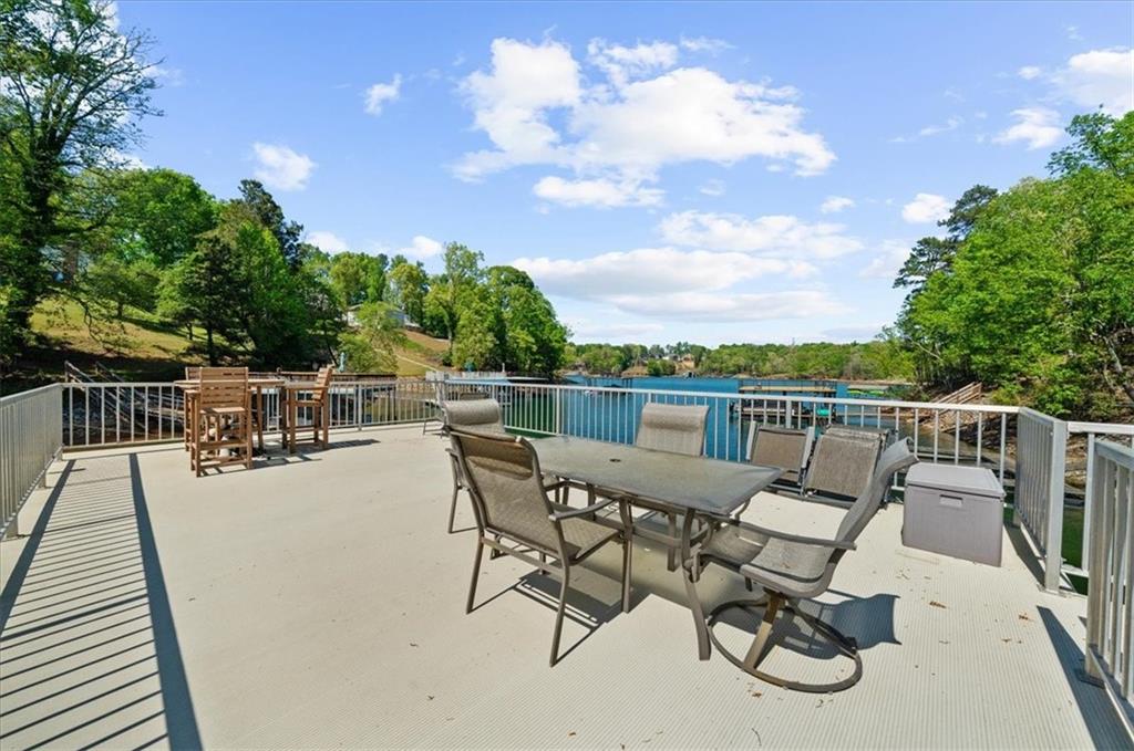 6551 Bermuda Lane Flowery Branch, GA 30542 - Photo 35 of 43 a view of a terrace with chairs