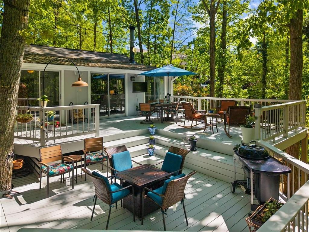 6551 Bermuda Lane Flowery Branch, GA 30542 - Photo 37 of 43 a patio with tables and chairs