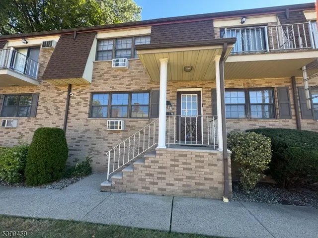 front view of a house with a small yard
