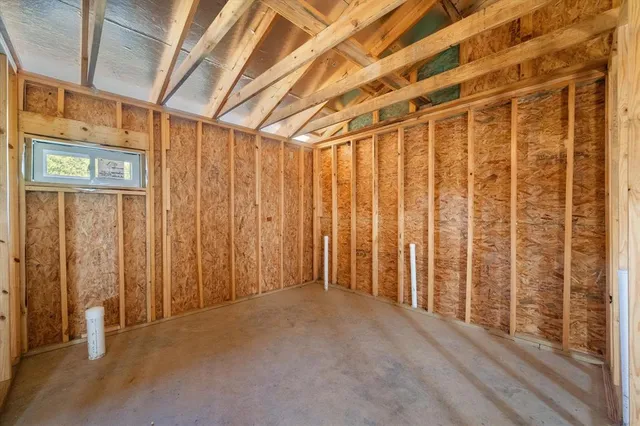 a view of a room with large windows