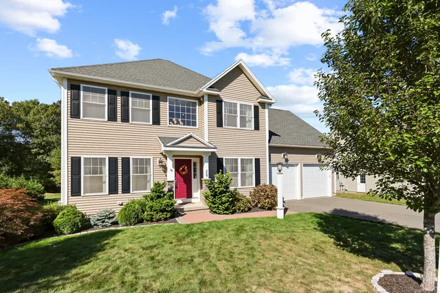 a front view of a house with a yard