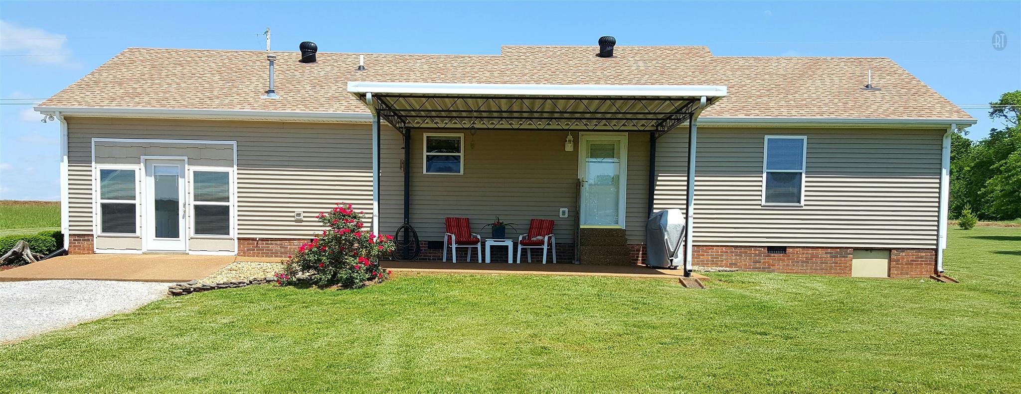 272 Collins Road Portland, TN 37148 - Photo 15 of 17 a front view of a house with garden
