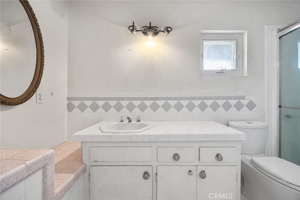 101 Hampden Terrace Alhambra, CA 91801 - Photo 33 of 46 a bathroom with a sink and a mirror
