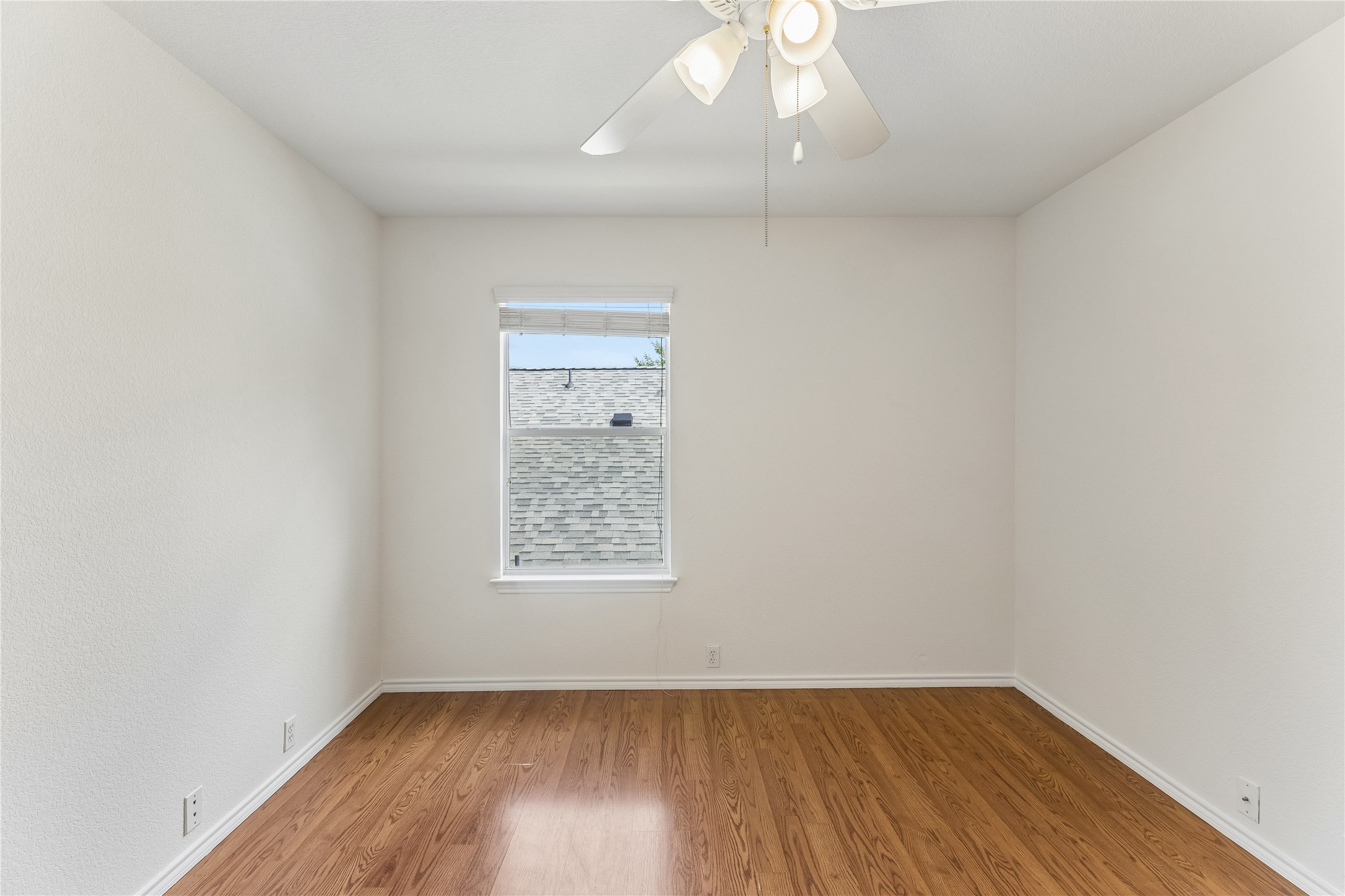 2372 Paradise Ridge Drive Round Rock, TX 78665 - Photo 33 of 40 Hardwood floors and a sun-drenched window create an inviting atmosphere.