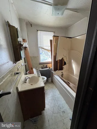 a bathroom with a sink and mirror