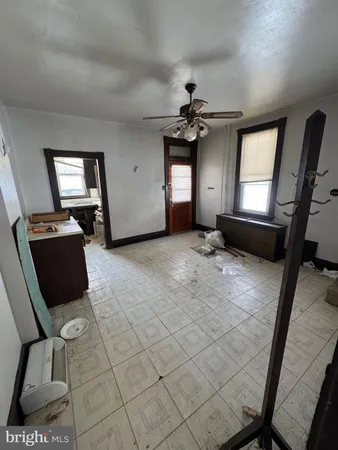 a view of a livingroom with furniture and windows