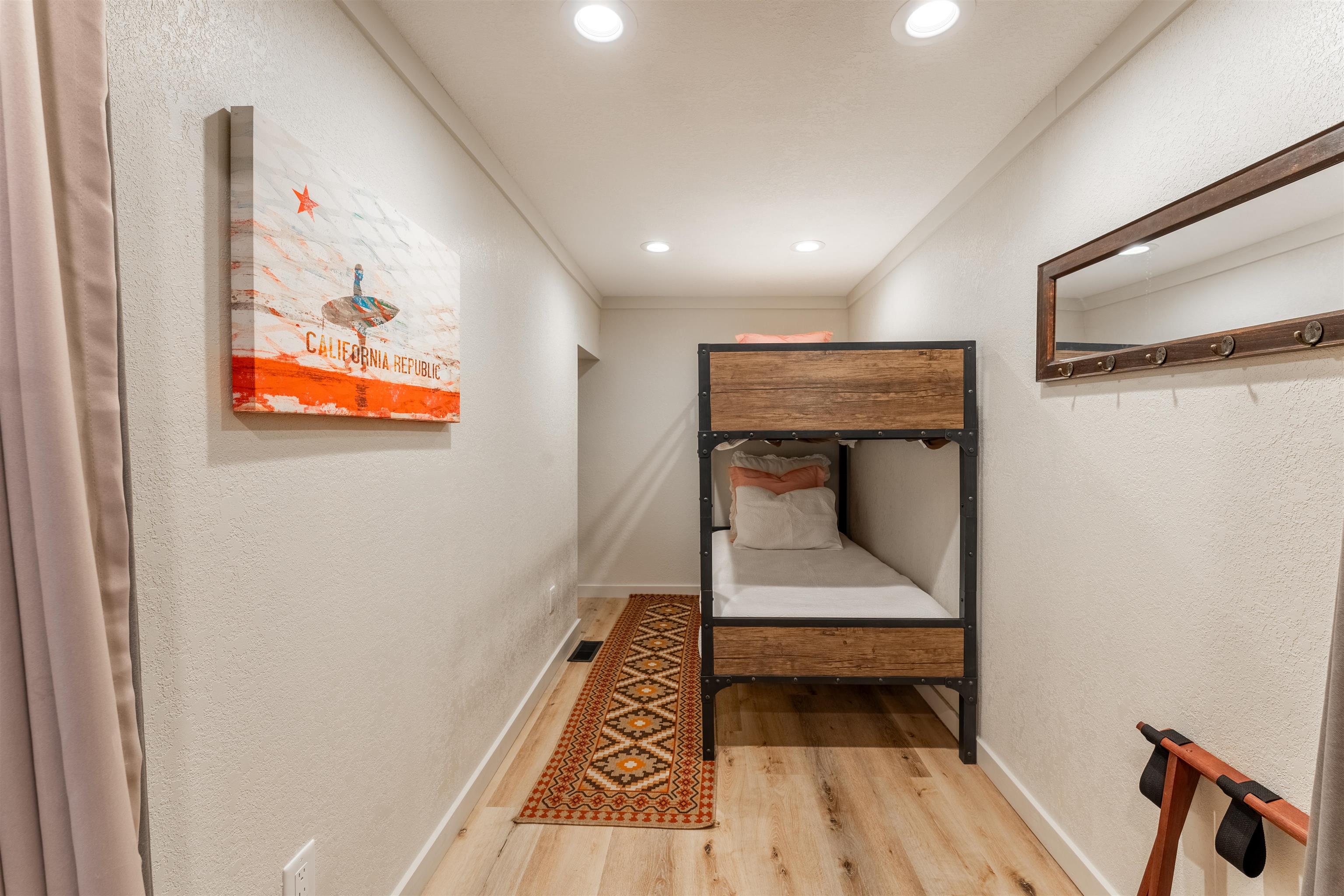 227 Olympic Vly Road, Unit 27 Olympic Valley, CA 96146 - Photo 15 of 21 a hallway with wooden floor and a bathroom