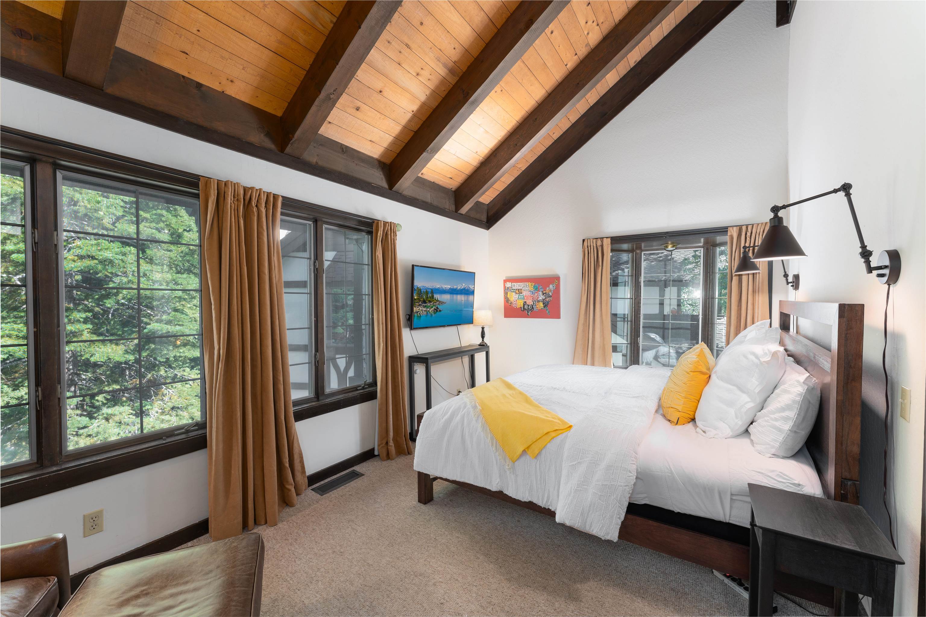 227 Olympic Vly Road, Unit 27 Olympic Valley, CA 96146 - Photo 6 of 21 a bedroom with furniture and large windows