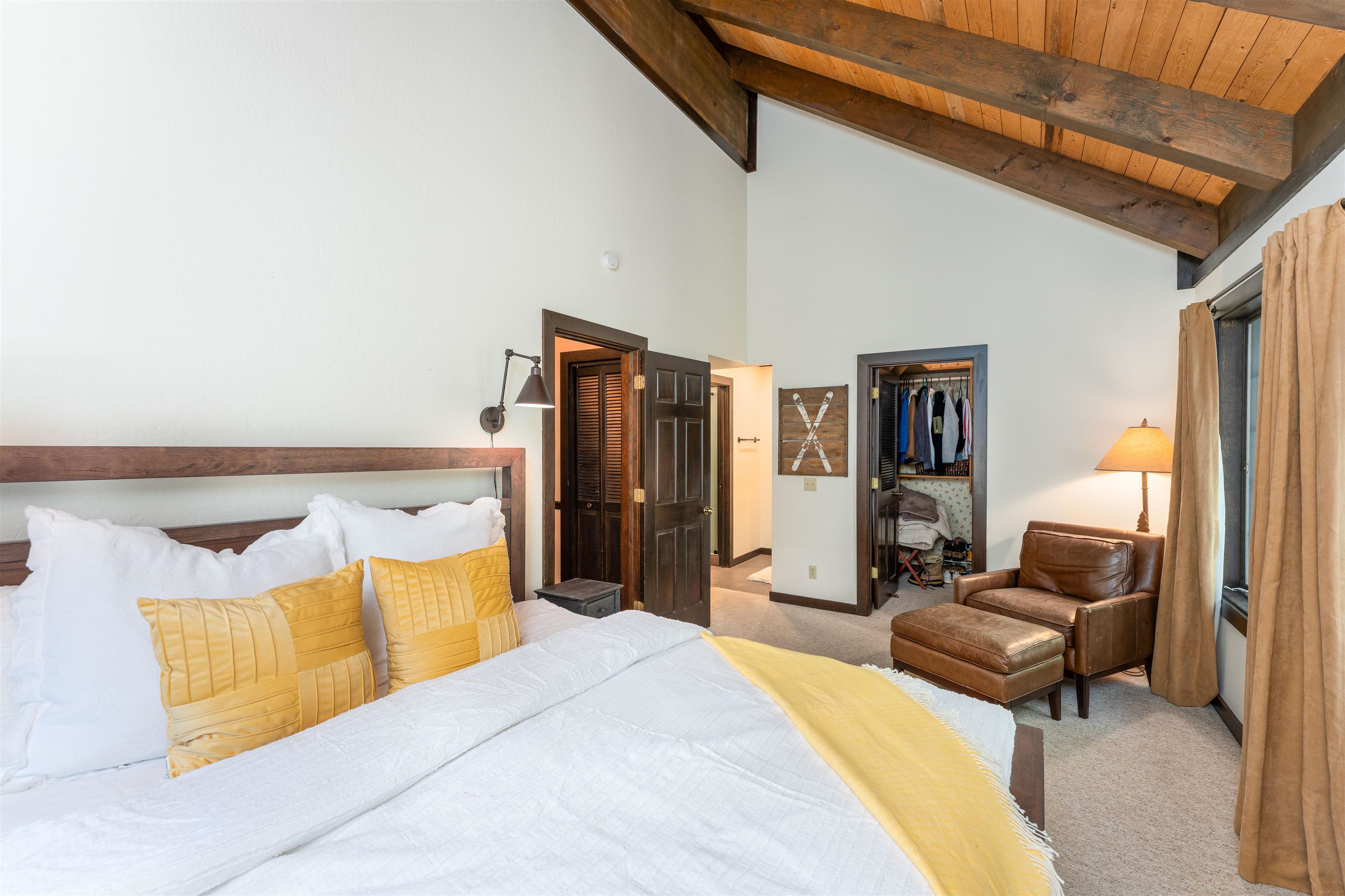 227 Olympic Vly Road, Unit 27 Olympic Valley, CA 96146 - Photo 7 of 21 a bedroom with a bed and wooden floor
