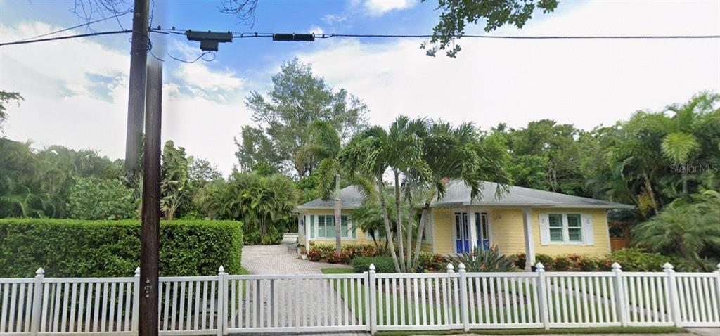 3473 Hamilton Avenue Sarasota, FL 34242 - Photo 2 of 3 a front view of a house with a garden