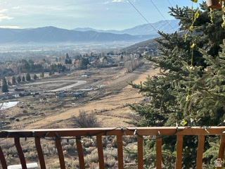 Expansive mountain valley scenery with distant peaks