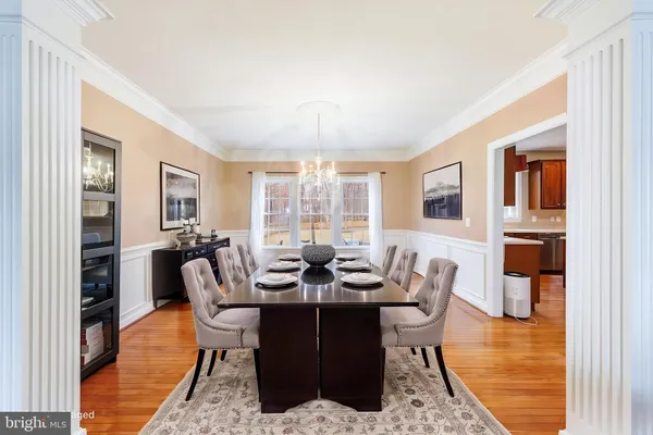 a living room with furniture and a large window with outer view
