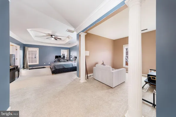 a large kitchen with stainless steel appliances granite countertop a refrigerator and a sink