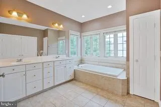 a view of a kitchen with a sink and a refrigerator