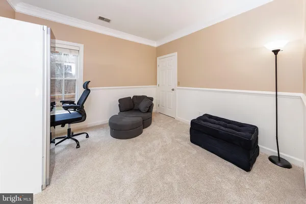 a front view of house with yard and outdoor seating