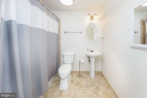 a picture of a bathroom with a sink