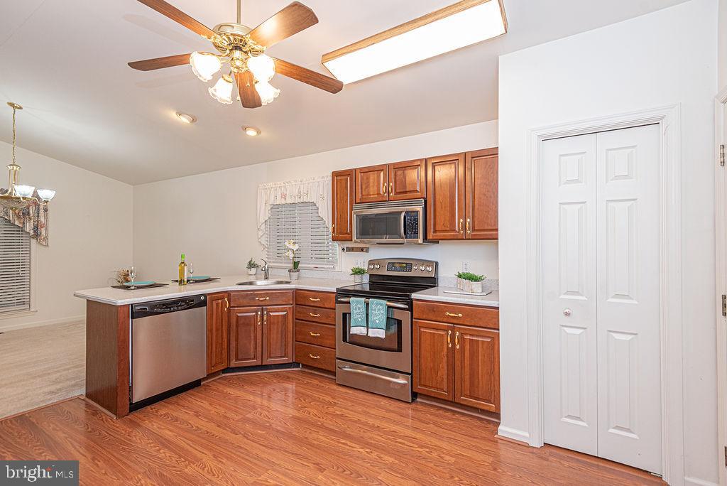 14 Liberty Street Ocean Pines, MD 21811 - Photo 14 of 69 a kitchen with stainless steel appliances granite countertop a stove and a sink