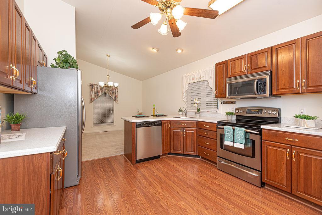 14 Liberty Street Ocean Pines, MD 21811 - Photo 18 of 69 a kitchen with a sink cabinets stainless steel appliances and a counter top space