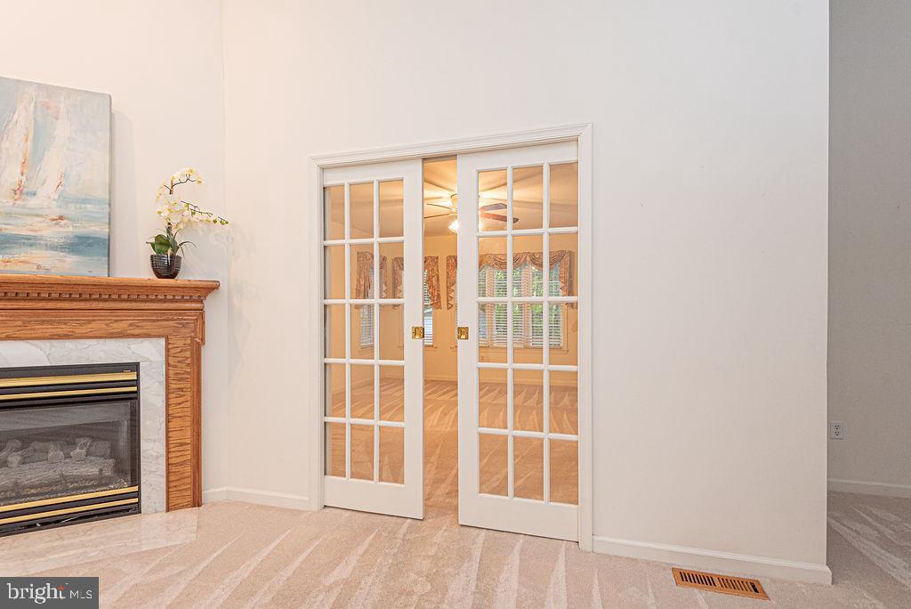 14 Liberty Street Ocean Pines, MD 21811 - Photo 22 of 69 a view of an empty room with wooden floor and a fireplace
