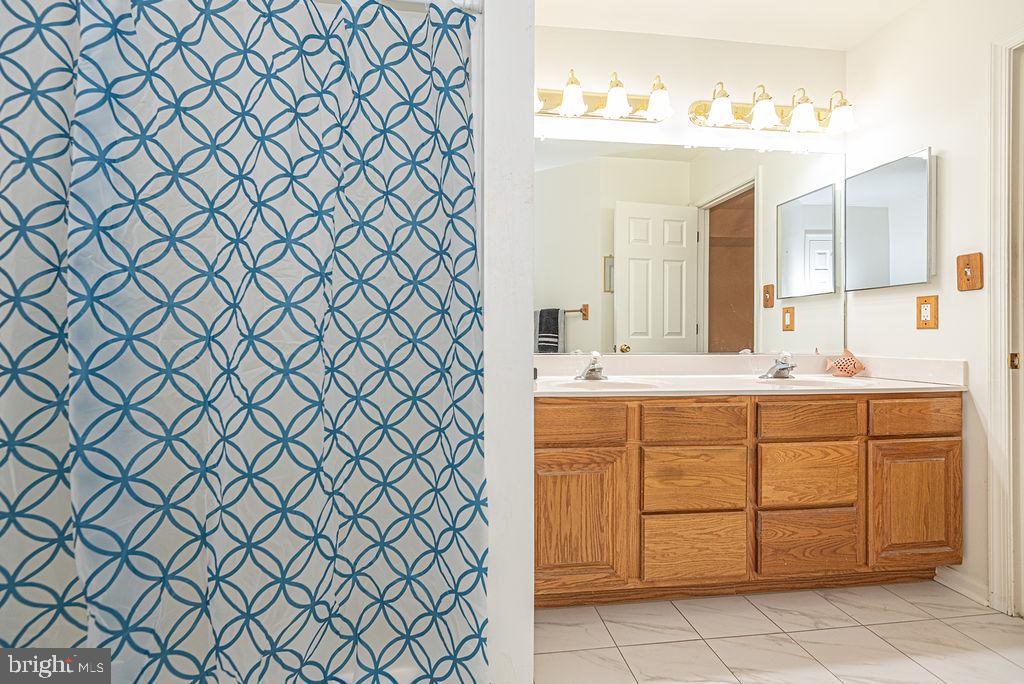 14 Liberty Street Ocean Pines, MD 21811 - Photo 39 of 69 a bathroom with a sink and a mirror
