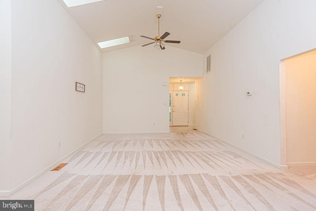 14 Liberty Street Ocean Pines, MD 21811 - Photo 9 of 69 a view of a room with wooden floor and a ceiling fan